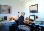 Barry Izak, professional organizer, at his home office
